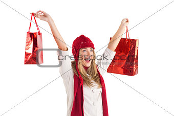 Pretty blonde carrying shopping bags