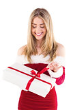 Pretty santa girl opening gift