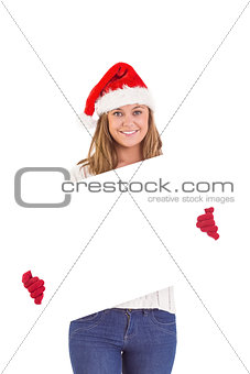 Festive blonde holding a poster