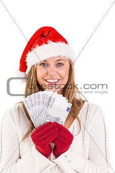 Festive blonde showing fan of euros