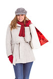 Happy blonde in winter clothes with bags