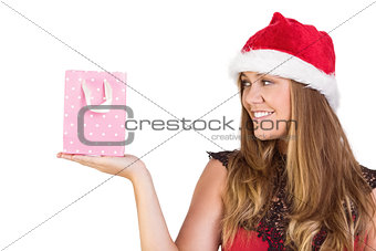 Festive blonde holding a gift bag
