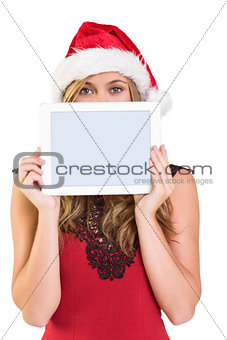 Festive blonde showing a tablet