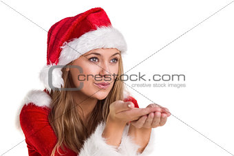 Festive blonde blowing over hands