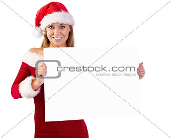 Festive blonde smiling at camera holding poster
