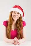 Festive redhead smiling at camera
