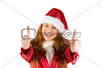 Festive redhead showing thumbs up