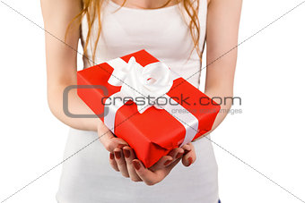 Woman holding red and white gift