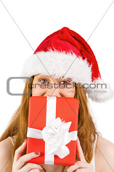Festive redhead holding a gift