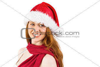 Festive redhead smiling at camera