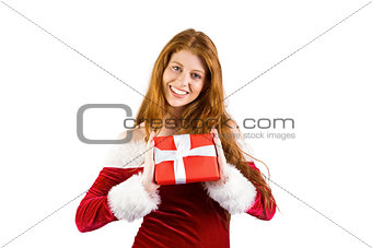 Festive redhead holding a gift
