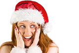 Festive redhead with hands on face