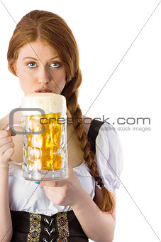 Oktoberfest girl drinking jug of beer