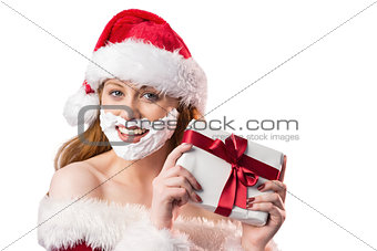 Festive redhead in foam beard holding gift