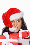 Irritated woman with christmas presents