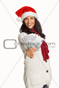 Woman holding money towards herself