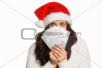 Woman holding money towards herself