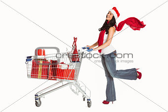 Woman standing with shopping trolley