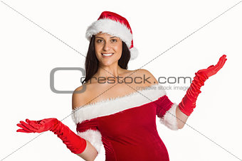Woman smiling with hands raised