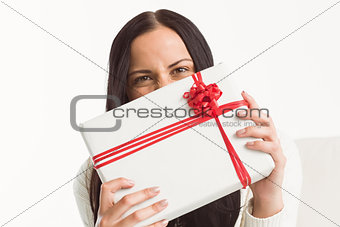 Woman holding a large present