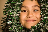 Cute little girl with tinsel around her head