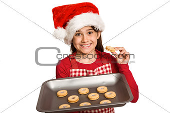 Festive little girl offering cookies