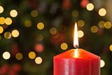 Focus on red christmas candle