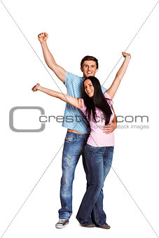 Young couple cheering at camera