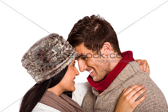 Young couple smiling and hugging