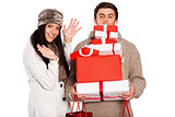 Young couple with many christmas presents
