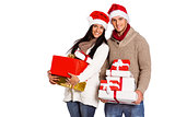 Young couple with many christmas presents