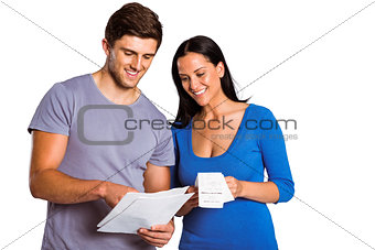 Young couple reading their bills