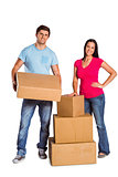 Young couple with moving boxes