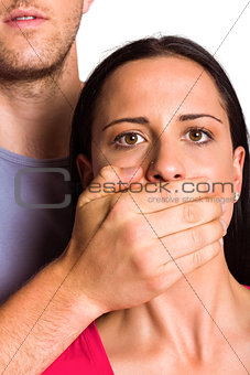 Man covering his girlfriends mouth