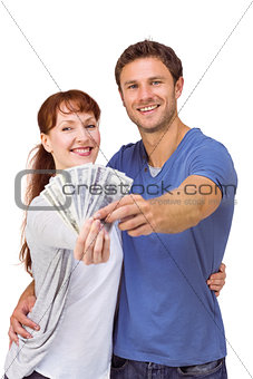 Couple holding fan of cash