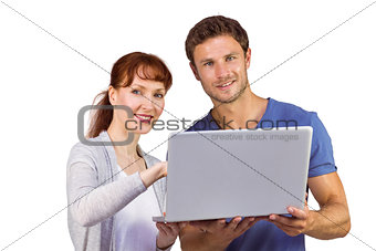 Couple using a laptop together