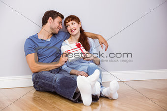 Couple sitting on floor together