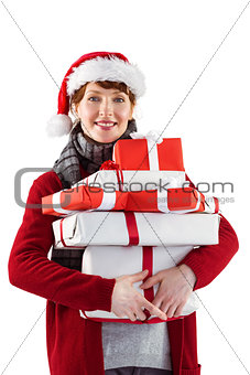 Smiling woman holding christmas presents
