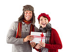 Couple smiling and holding gift