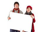Couple holding a large sign