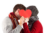 Couple holding a red heart
