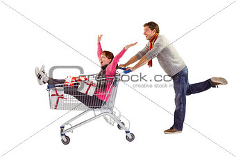 Man pushing woman in trolley