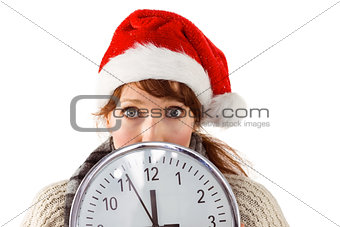 Woman holding a large clock