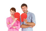 Couple holding a broken heart