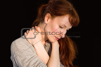 Scared woman holding herself