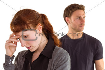 Worried woman with man behind