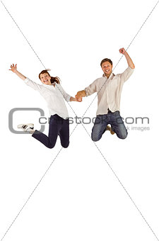 Couple jumping and holding hands