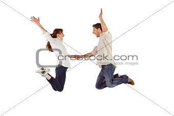 Couple jumping and holding hands