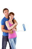 Couple hugging and holding brush