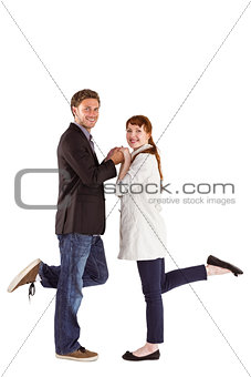 Smiling couple with raised legs